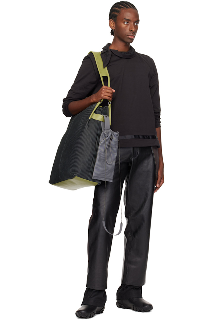 Buffed leather and cotton twill trousers. 

· Paneled construction
· Belt loops
· Stripe-embossed nubuck trim at waist
· Four-pocket styling
· Zip-fly
· Studs at front
· Zip vent at inset cotton seersucker cuffs
· Full cotton seersucker lining

Part of the ECCO.kollektive x Kiko Kostadinov collaboration.

Supplier color: Black/Turtle green