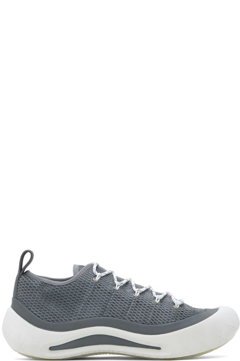 Low-top suede sneakers in gray.

· Rubberized trim and perforated detailing throughout
· Lace-up closure
· Pull-loop at heel tab
· Suede lining
· Sculptural rubber midsole
· Treaded rubber sole

Part of the ECCO.kollektive x Nina Christen collaboration.

Supplier color: Steel gray/Bright white