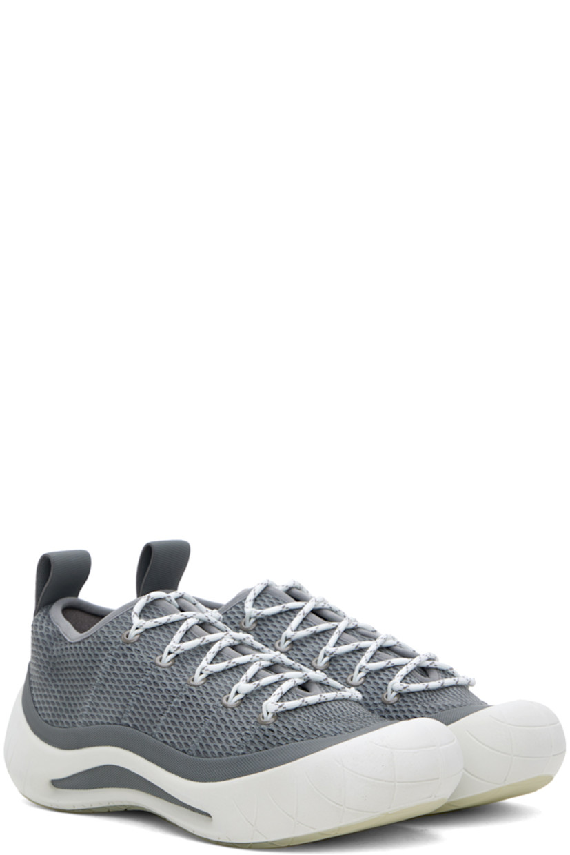Low-top suede sneakers in gray.

· Rubberized trim and perforated detailing throughout
· Lace-up closure
· Pull-loop at heel tab
· Suede lining
· Sculptural rubber midsole
· Treaded rubber sole

Part of the ECCO.kollektive x Nina Christen collaboration.

Supplier color: Steel gray/Bright white