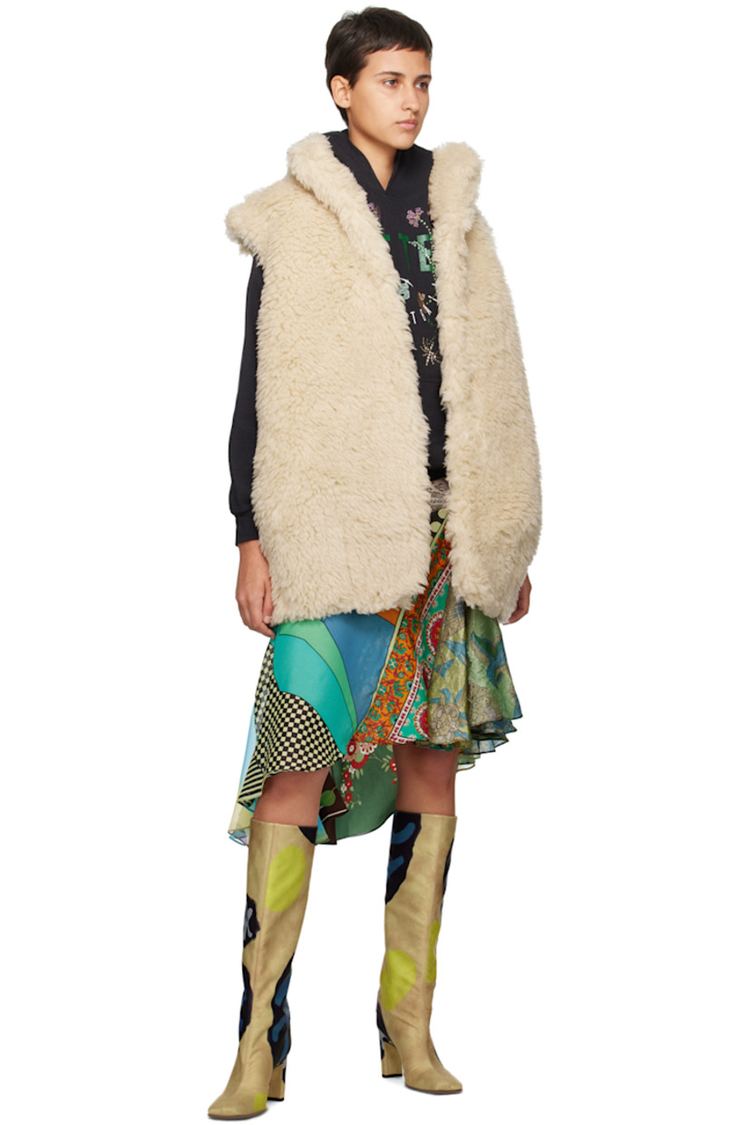 Padded virgin wool-blend sherpa fleece vest.

· Funnel neck
· Hook-eye closure
· Full twill lining

Supplier color: Cream