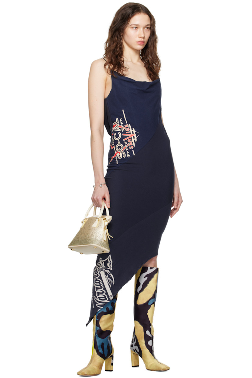 Upcycled cotton jersey dress. Graphics printed throughout. 

· Bias-cut and paneled construction
· Cowl neck
· Asymmetrical hem
· Concealed zip closure at side seam
· Adjustable spaghetti straps
· Low back 

Part of the Magnolia collection. 

Each item is unique. Please note that finishings may vary.

Supplier color: Multi blue