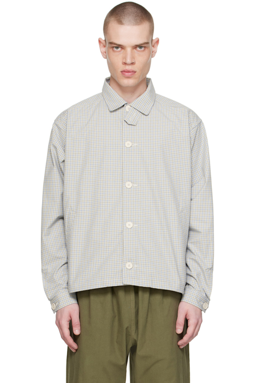 Cotton poplin jacket. Check pattern printed throughout.

· Button tab at spread collar
· Button closure
· Welt pockets
· Partially elasticized hem
· Single-button barrel cuffs
· Storm flap and twin pleats at back yoke
· Flat-felled seams at interior
· Recycled paper hardware

Supplier color: Checkered blue