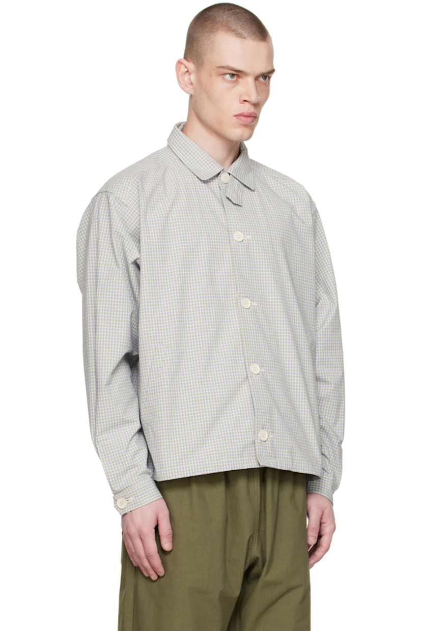 Cotton poplin jacket. Check pattern printed throughout.

· Button tab at spread collar
· Button closure
· Welt pockets
· Partially elasticized hem
· Single-button barrel cuffs
· Storm flap and twin pleats at back yoke
· Flat-felled seams at interior
· Recycled paper hardware

Supplier color: Checkered blue