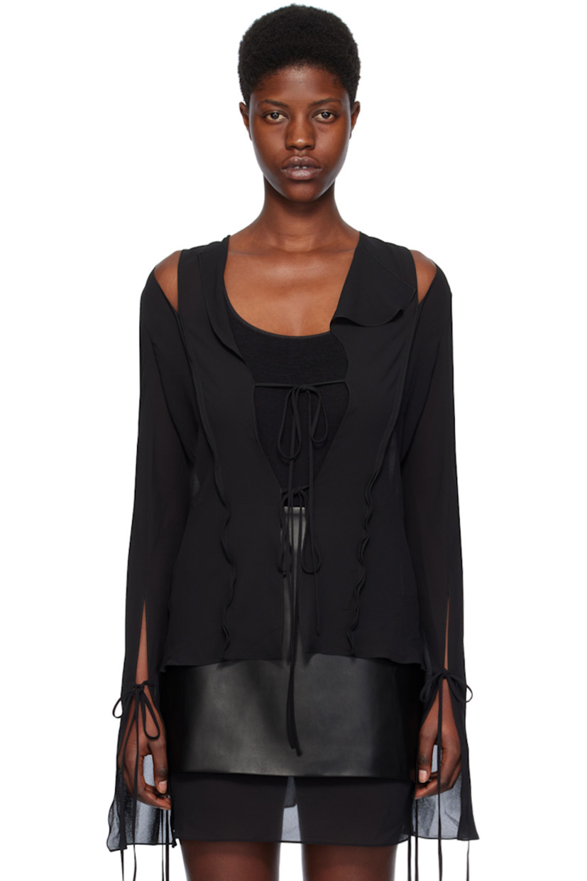 Semi-sheer polyester chiffon blouse. Ruffled edges throughout.

· Modified spread collar
· Self-tie closure
· Self-tie fastening at vented flared cuffs
· Cutout at back shoulders

Supplier color: Black