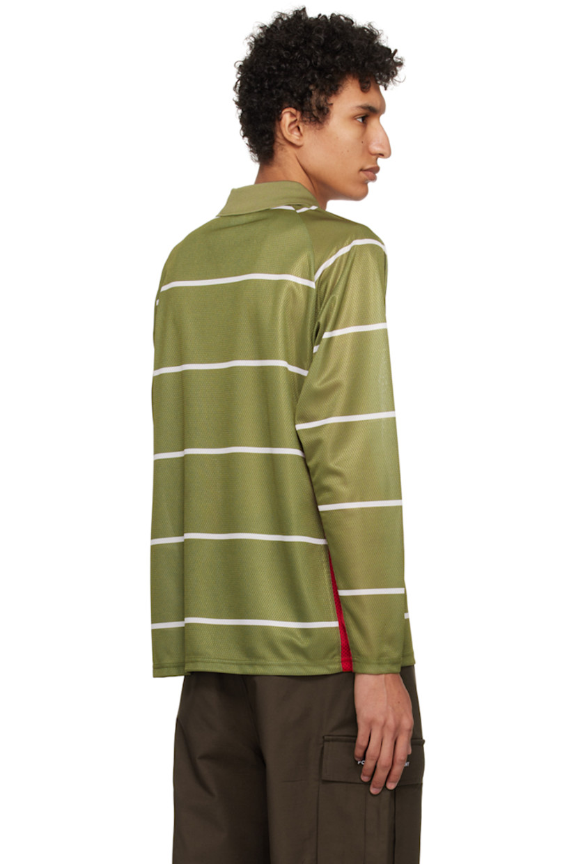 Polyester jersey and mesh polo. Stripes printed throughout. 

· Rib knit spread collar and v-neck
· Logo embroidered at chest
· Text bonded at front 
· Logo bonded at sleeve

Supplier color: Loden green