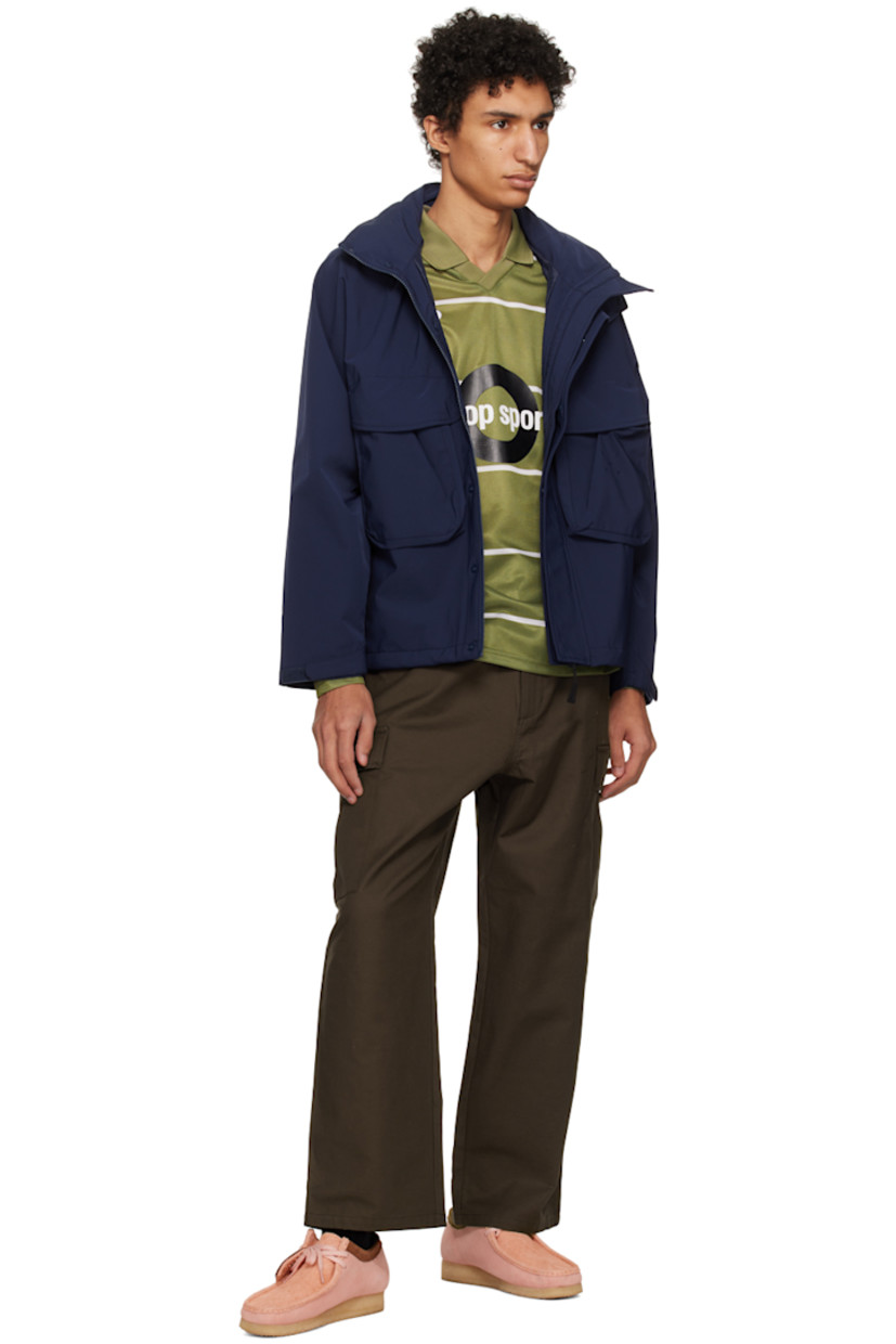 Polyester jersey and mesh polo. Stripes printed throughout. 

· Rib knit spread collar and v-neck
· Logo embroidered at chest
· Text bonded at front 
· Logo bonded at sleeve

Supplier color: Loden green