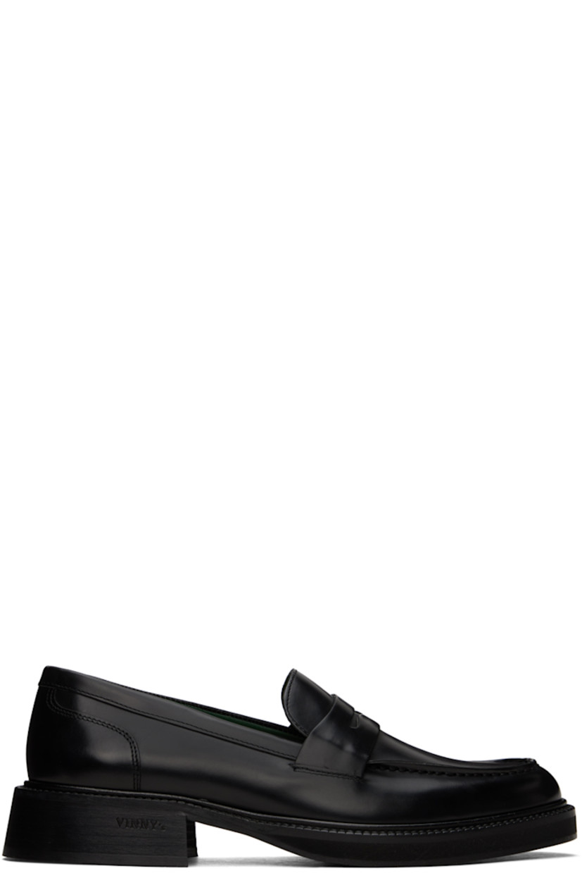 Polished leather loafers in black.

· Moc toe
· Strap with cutout at vamp
· Serrated edge at welt 
· Logo stamp at padded footbed
· Stacked leather heel with rubber injection
· Leather sole with rubber injection 
· Heel: H1.5" 

Supplier color: Black