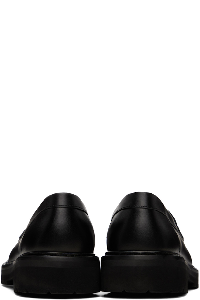 Buffed nappa leather loafers in black.

· Moc toe
· Strap with cutout at vamp
· Logo stamp at padded footbed
· Logo embossed at foam rubber midsole
· Treaded Vibram®Vi-Lite rubber outsole
· Heel: H1.5"

Supplier color: Black