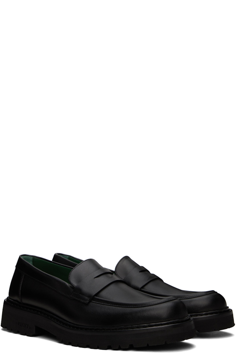 Buffed nappa leather loafers in black.

· Moc toe
· Strap with cutout at vamp
· Logo stamp at padded footbed
· Logo embossed at foam rubber midsole
· Treaded Vibram®Vi-Lite rubber outsole
· Heel: H1.5"

Supplier color: Black