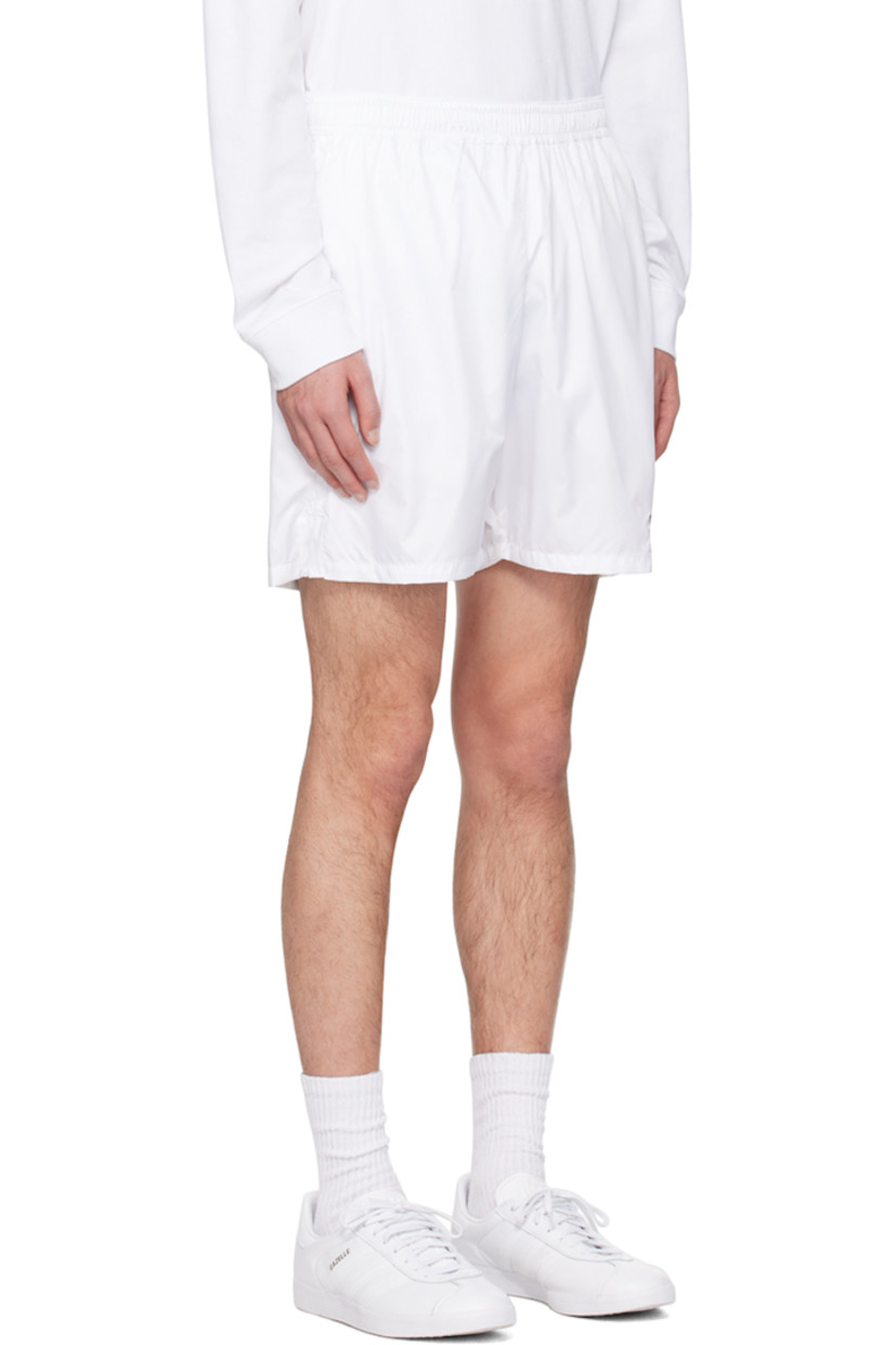 Polyester satin shorts.

· Concealed drawstring at elasticized waistband
· Two-pocket styling
· Logo embroidered at front cuff
· Vented cuffs

Supplier color: White