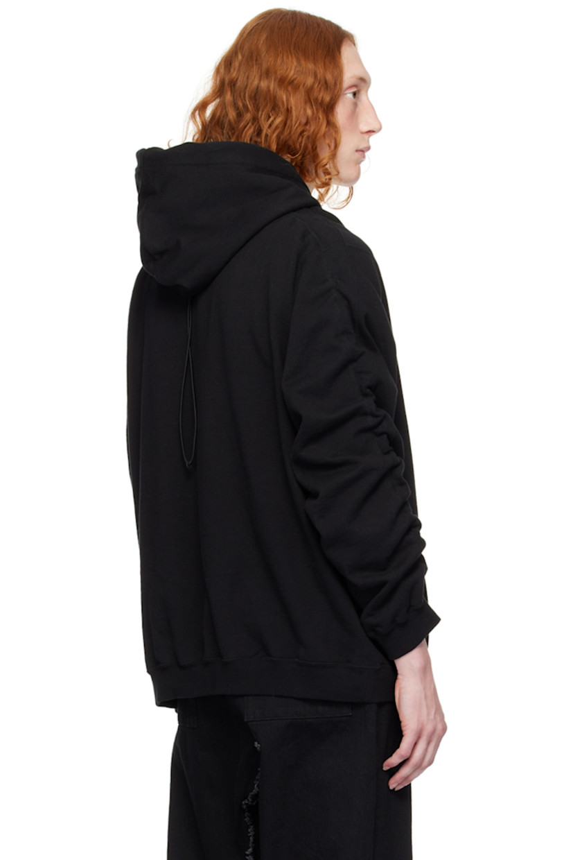 French terry hoodie.

· Drawstring at hood
· Welt pockets
· Rib knit hem and cuffs
· Dropped shoulders
· Ruching at sleeves
· Bungee-style drawstring at back collar

Supplier color: Black