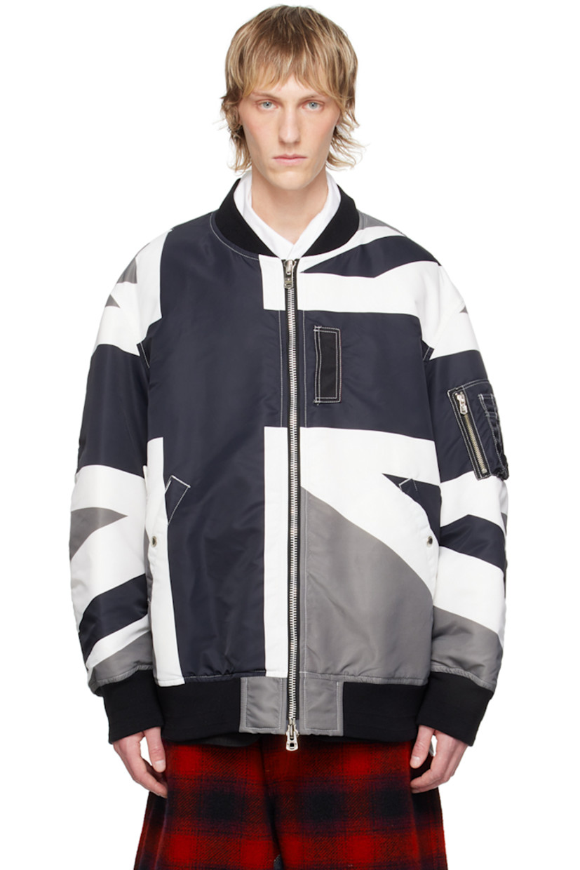 Padded nylon twill bomber jacket. Graphic printed throughout.

· Rib knit stand collar, hem, and cuffs
· Two-way zip closure
· Press-stud tab at front
· Welt pockets
· Utility pocket at sleeve
· Gusset at back sleeves
· Welt pockets at interior
· Full twill lining

Supplier color: Monotone