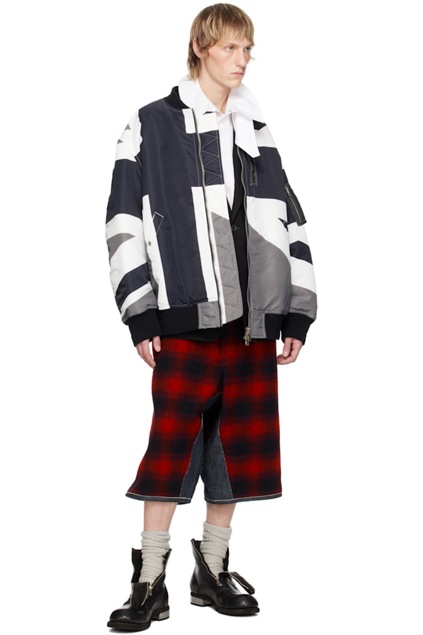 Padded nylon twill bomber jacket. Graphic printed throughout.

· Rib knit stand collar, hem, and cuffs
· Two-way zip closure
· Press-stud tab at front
· Welt pockets
· Utility pocket at sleeve
· Gusset at back sleeves
· Welt pockets at interior
· Full twill lining

Supplier color: Monotone