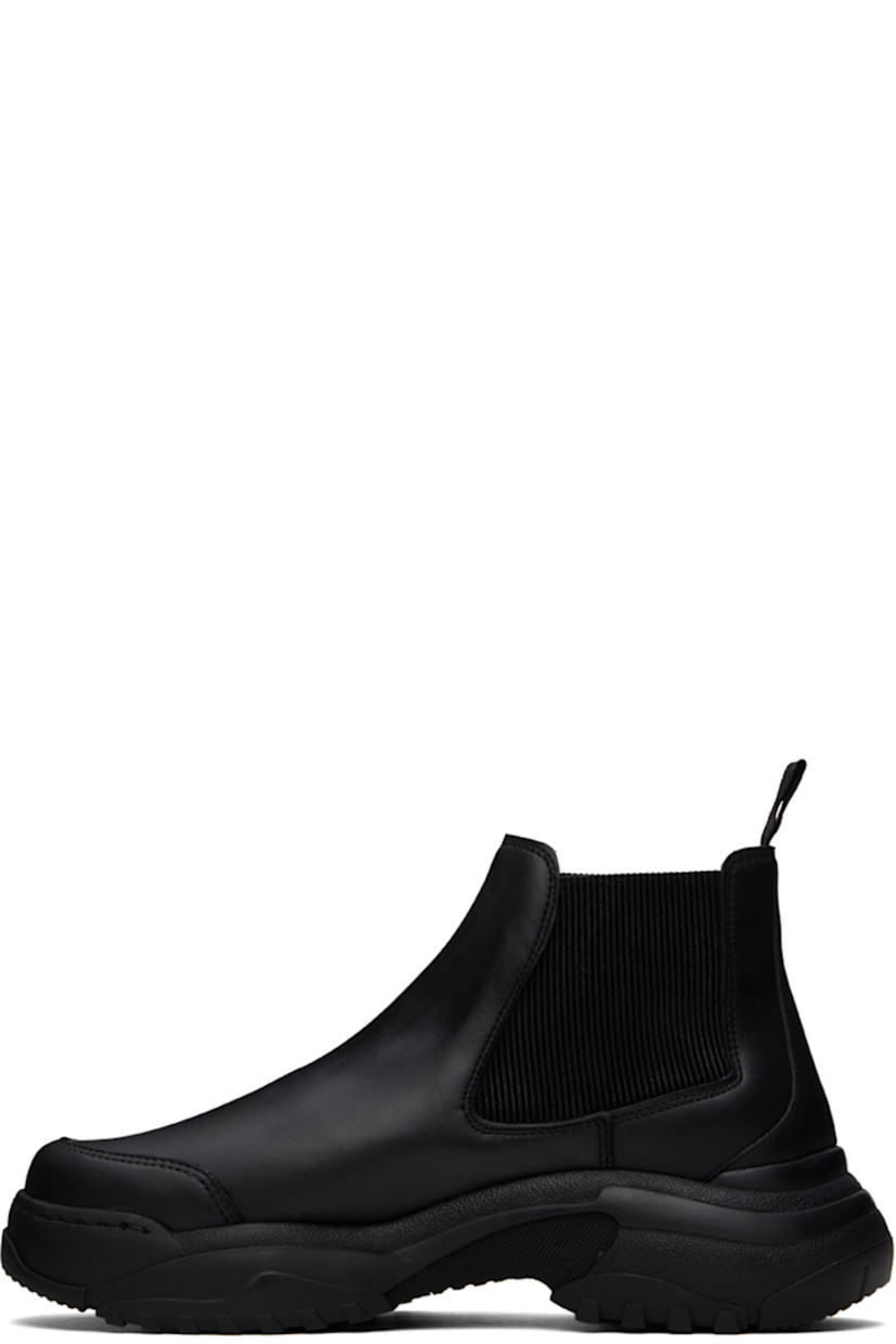 Ankle-high buffed apple- and polyurethane-blend faux-leather Chelsea boots in black.

· Logo-embossed rubber trim at toe
· Elasticized gusset at sides
· Webbing pull-loop at heel collar
· Buffed faux-leather lining
· Treaded rubber sole

Supplier color: Black apple pam