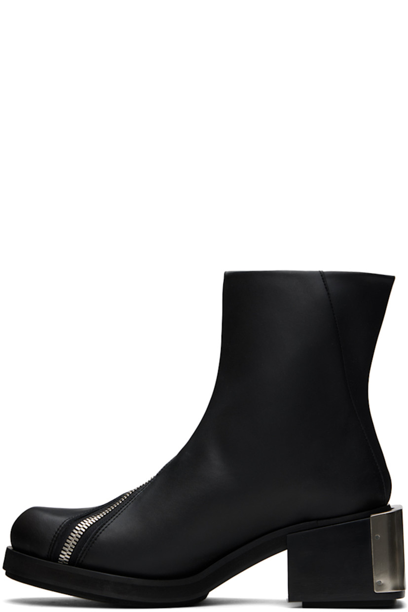 Ankle-high buffed faux-leather boots in black.

· Offset zip closure at vamp
· Logo plaque at block heel
· Foam rubber midsole
· Faux-leather sole with rubber injections
· Logo-engraved silver-tone hardware
· Heel: H2.25"

Supplier color: Black apple pam