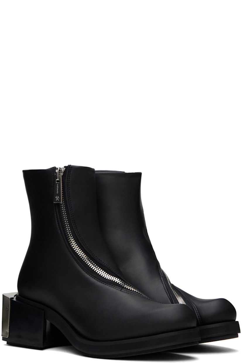 Ankle-high buffed faux-leather boots in black.

· Offset zip closure at vamp
· Logo plaque at block heel
· Foam rubber midsole
· Faux-leather sole with rubber injections
· Logo-engraved silver-tone hardware
· Heel: H2.25"

Supplier color: Black apple pam