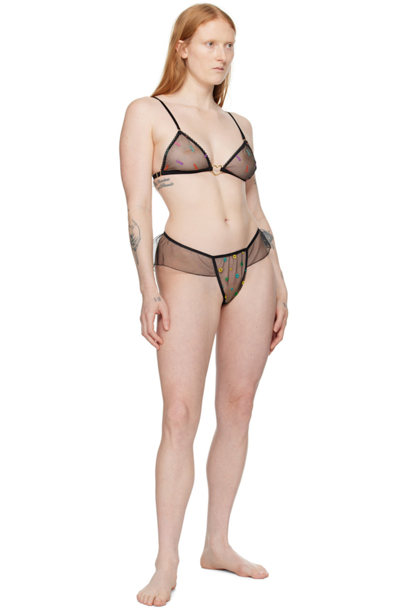 Semi-sheer recycled polyester tulle bra. Text embroidered throughout.

· Sweetheart neck
· Satin frill trim at front
· Graphic hardware at front 
· Elasticized hem
· Adjustable elasticized shoulder straps
· Adjustable hook-eye fastening at back

Supplier color: Black