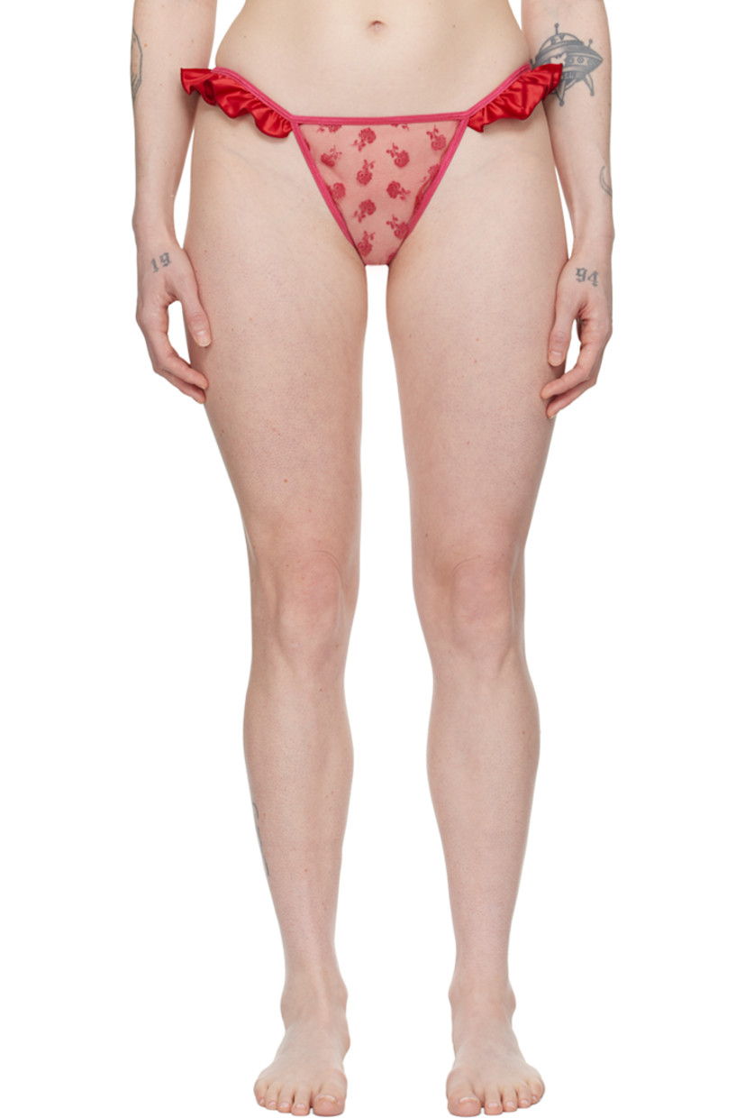 Semi-sheer polyester tulle thong. Floral pattern flocked throughout.

· Elasticized waistband
· Satin ruffles at outseams
· Hook-eye fastening and cutout at back 

Supplier color: Pink/Red