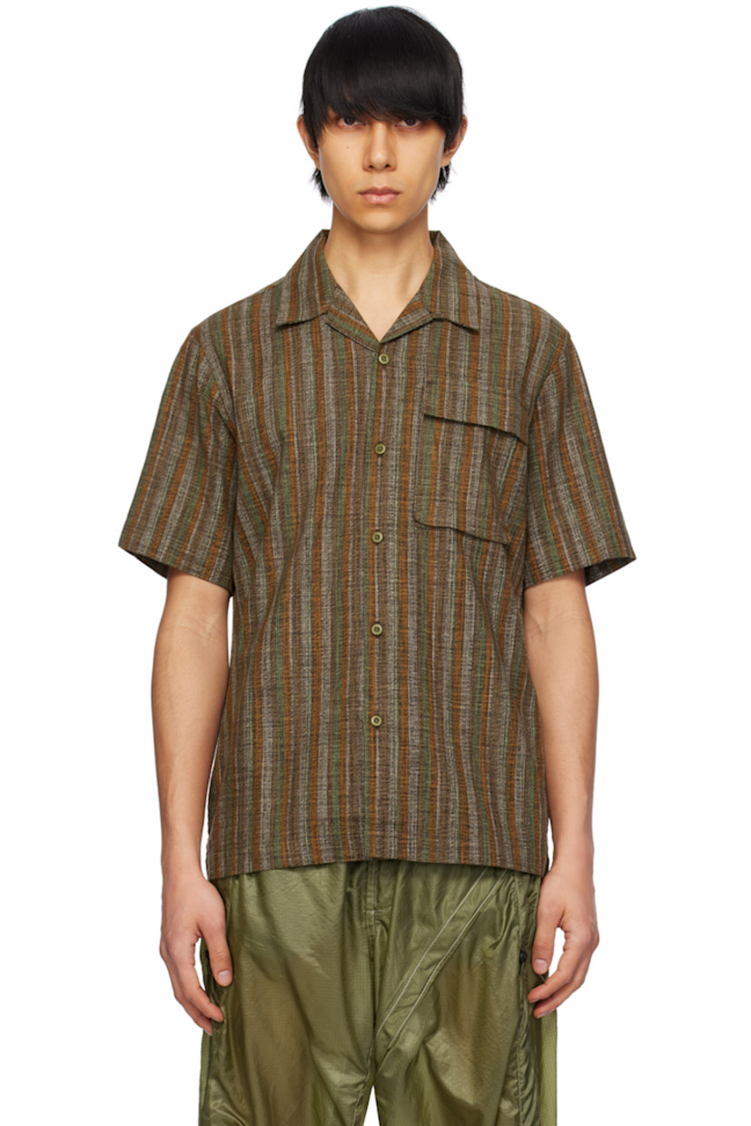 Lightweight and breathable cotton gauze shirt. Stripes throughout.

· Open spread collar
�· Button closure
· Flap pocket
· Logo flag at side seam

Supplier color: Olive