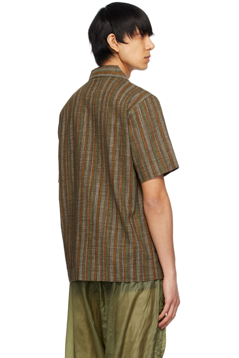 Lightweight and breathable cotton gauze shirt. Stripes throughout.

· Open spread collar
· Button closure
· Flap pocket
· Logo flag at side seam

Supplier color: Olive