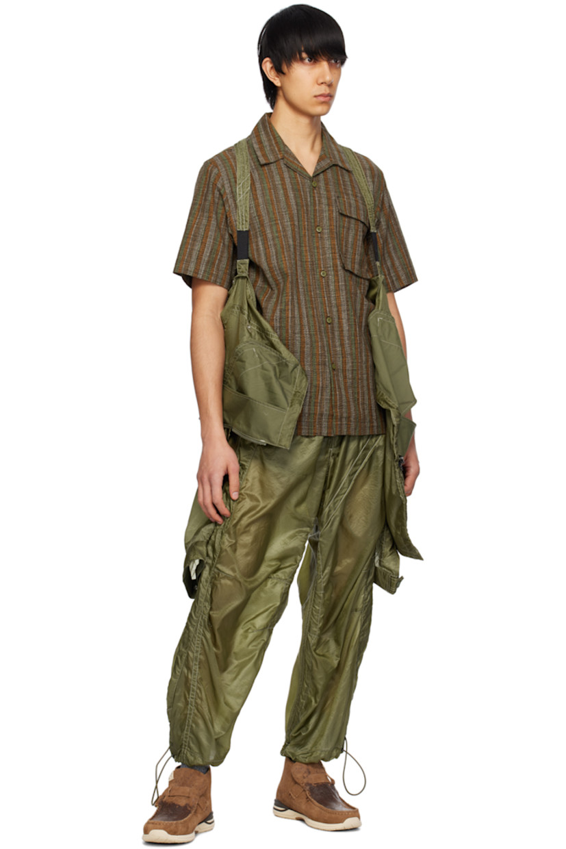Lightweight and breathable cotton gauze shirt. Stripes throughout.

· Open spread collar
· Button closure
· Flap pocket
· Logo flag at side seam

Supplier color: Olive