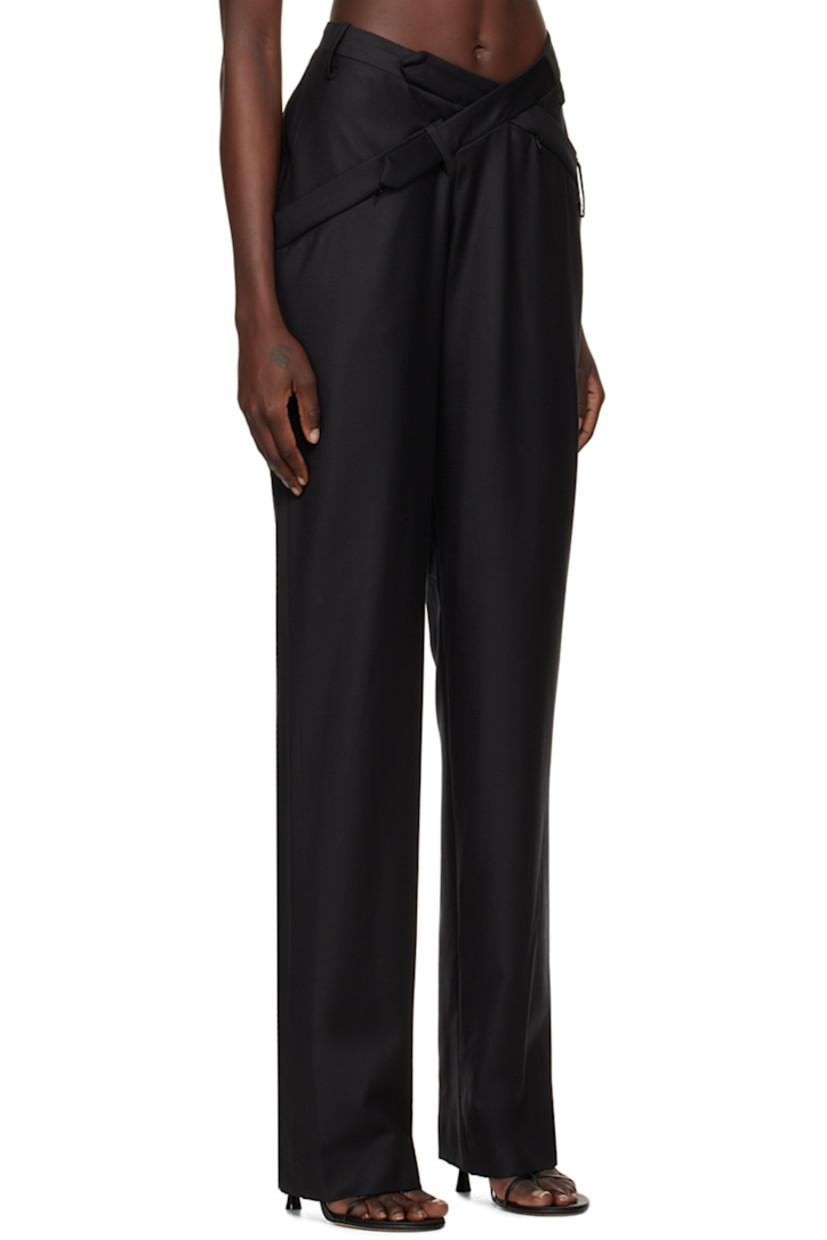 Relaxed-fit straight-leg wool twill trousers.

· Belt loops at asymmetric waistband
· Three-pocket styling
· Welt pocket at outseam
· Belt loops and belt-style trim at back 

Supplier color: Black