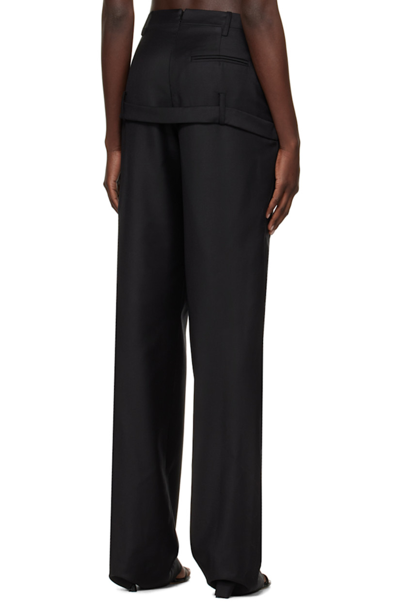 Relaxed-fit straight-leg wool twill trousers.

· Belt loops at asymmetric waistband
· Three-pocket styling
· Welt pocket at outseam
· Belt loops and belt-style trim at back 

Supplier color: Black