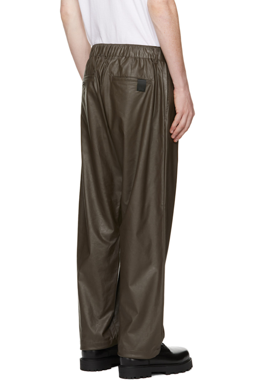 Lightweight crinkled faux-leather trousers. 

· Concealed drawstring at partially elasticized waistband
· Belt loops
· Four-pocket styling
· Zip-fly
· Concealed bungee-style drawstring at cuffs 
· Logo patch at back pocket 
· Unlined 

Supplier color: Brown