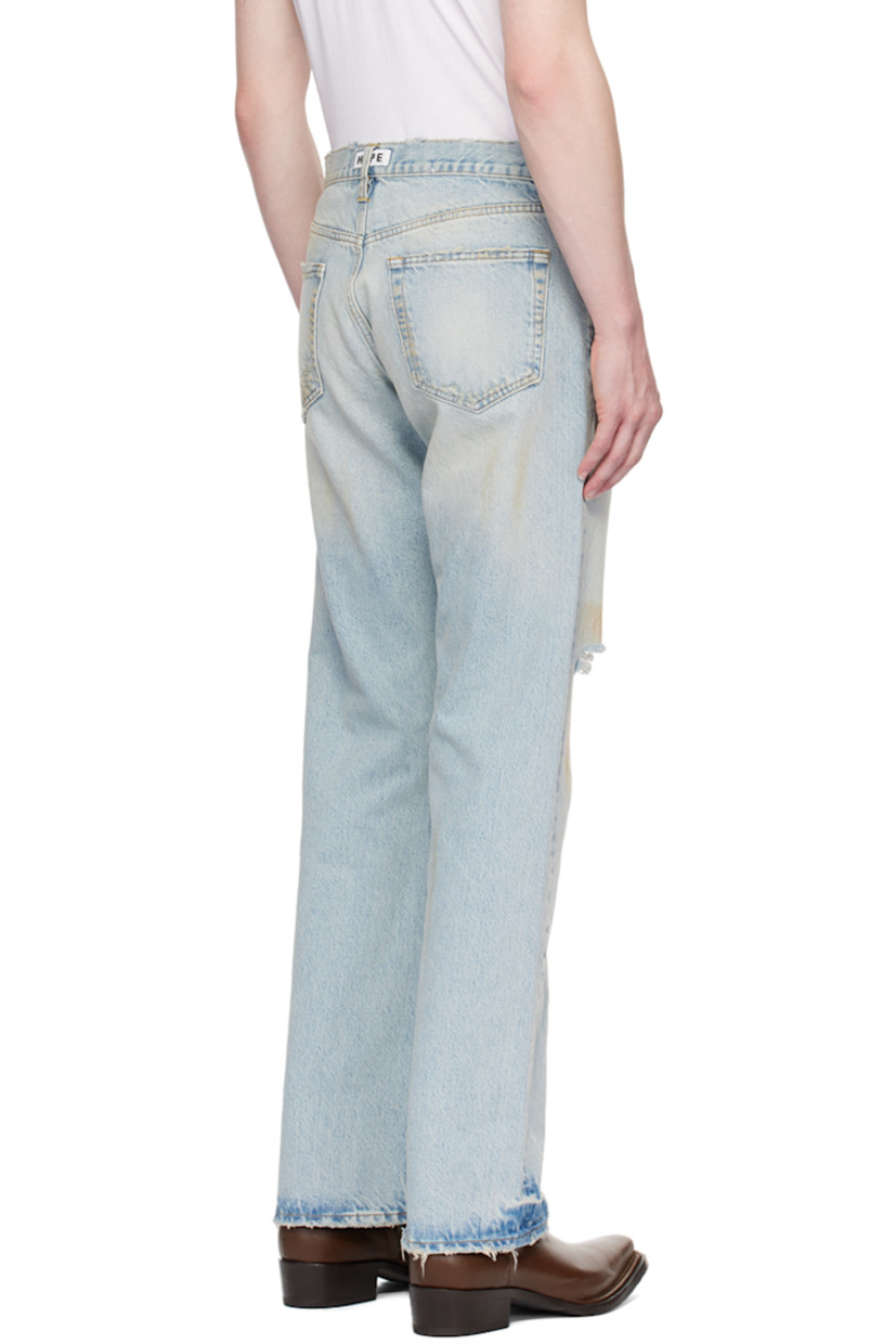 Relaxed-fit non-stretch organic cotton denim jeans. Embroidered detailing, smudging, distressing, and fading throughout.

· Belt loops
· Five-pocket styling 
· Button-fly
· Logo patch at back waist
· Contrast stitching in tan 

Supplier color: Dirty blue vintage