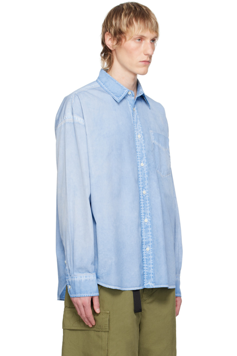 Garment-dyed cotton poplin shirt. Fading throughout.

· Spread collar
· Button closure
· Patch pocket 
· Shirttail hem
· Dropped shoulders
· Adjustable single-button barrel cuffs
· Box pleat at back yoke
· Mother-of-pearl hardware

Supplier color: Aqua blue