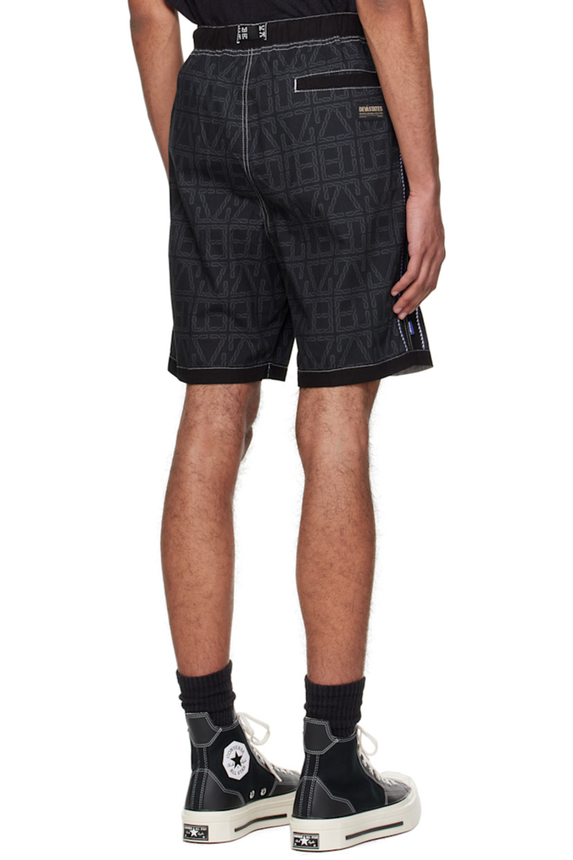 Plain-woven cotton shorts. Logo pattern printed throughout. 

· Webbing cinch belt at elasticized waistband
· Three-pocket styling
· Logo flag at outseam 
· Graphic pattern embroidered at outseams 
· Logo patch at back 
· Contrast stitching in white 

Supplier color: Black