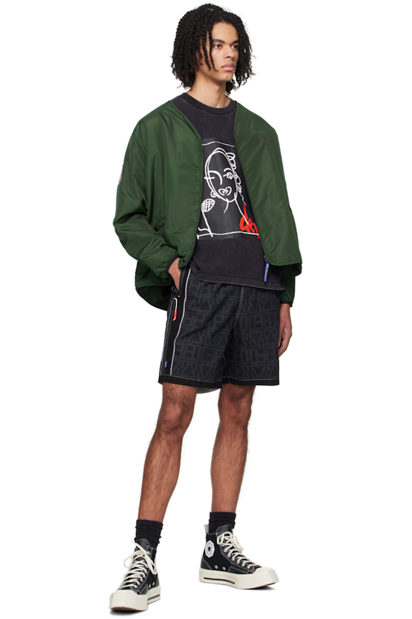 Plain-woven cotton shorts. Logo pattern printed throughout. 

· Webbing cinch belt at elasticized waistband
· Three-pocket styling
· Logo flag at outseam 
· Graphic pattern embroidered at outseams 
· Logo patch at back 
· Contrast stitching in white 

Supplier color: Black