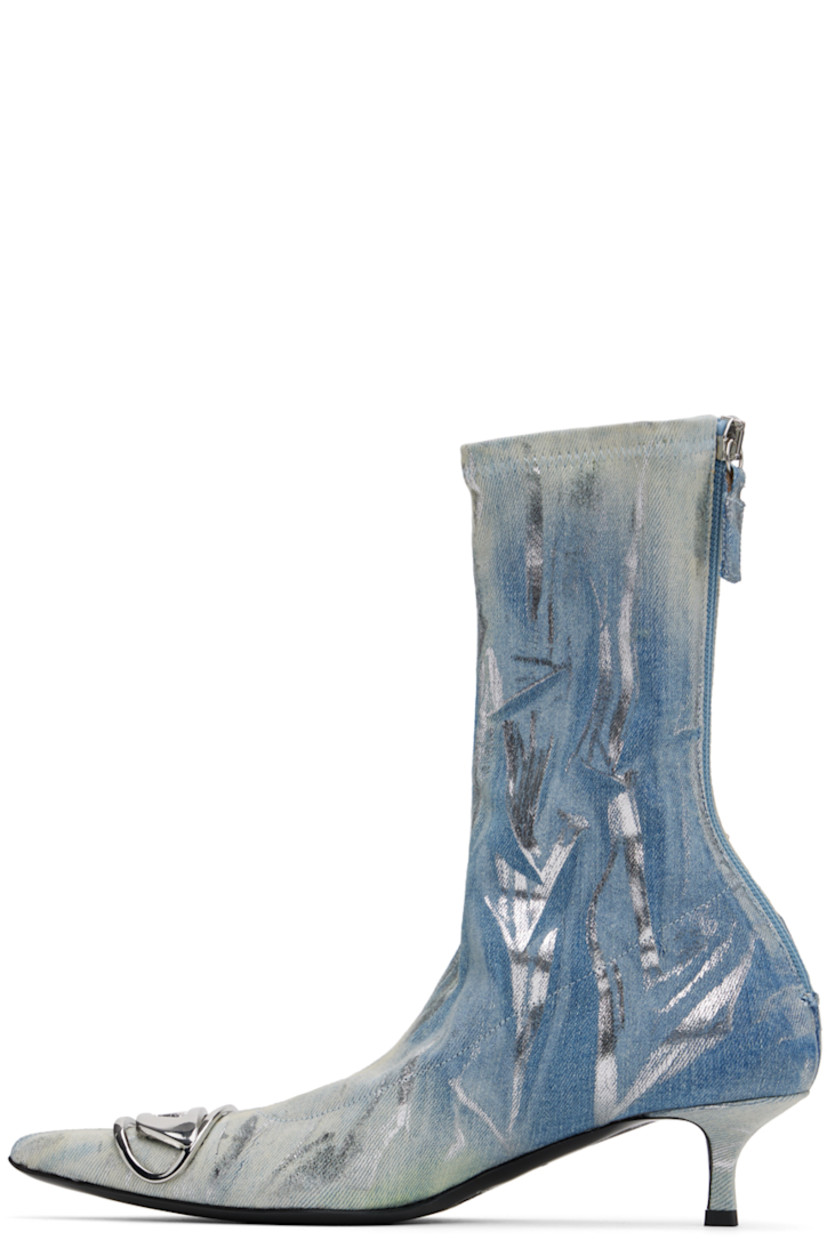 Mid-calf stretch denim boots in blue

· Fading and smudged dye throughout
· Logo hardware at pointed toe
· Elasticized collar
· Zip closure at heel
· Faux-leather lining
· Covered kitten heel with rubber injection
· Polished leather sole
· Heel: H1.75"

Each item is unique. Please note coloration may vary.

Supplier color: Blue