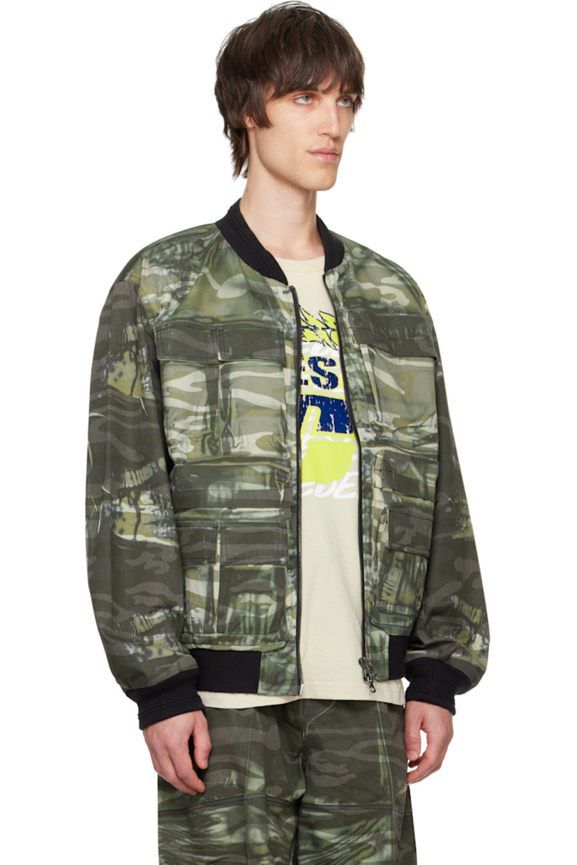 Polyester- and cotton-blend twill bomber jacket. Bleached effect and camouflage pattern printed throughout. 

· Rib-knit stand collar, hem, and cuffs
· Two-way zip closure
· Flap and welt pockets 
· Dropped shoulders
· Logo embroidered at sleeve
· Patch pocket at interior
· Fully lined

Supplier color: Green