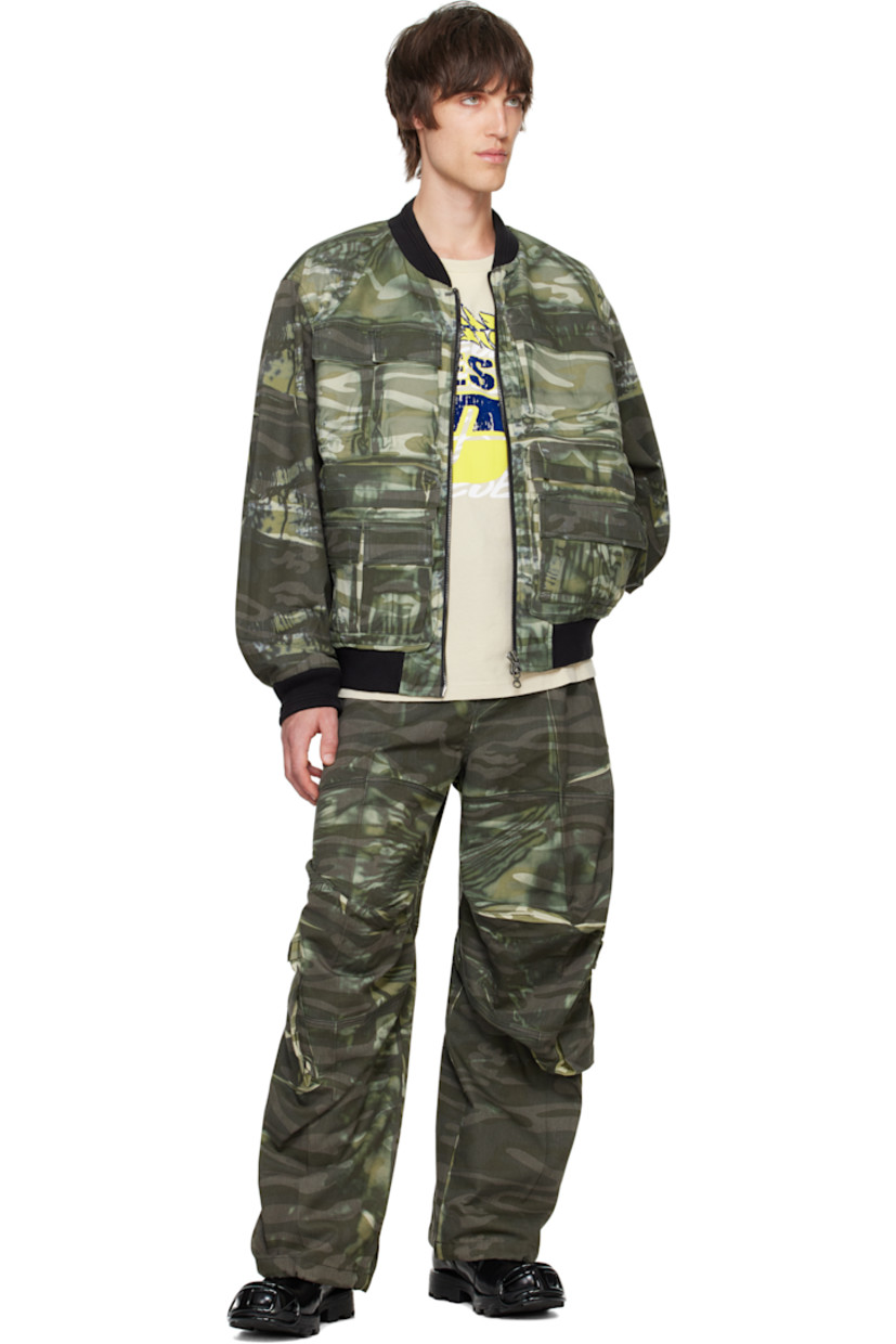 Polyester- and cotton-blend twill bomber jacket. Bleached effect and camouflage pattern printed throughout. 

· Rib-knit stand collar, hem, and cuffs
· Two-way zip closure
· Flap and welt pockets 
· Dropped shoulders
· Logo embroidered at sleeve
· Patch pocket at interior
· Fully lined

Supplier color: Green