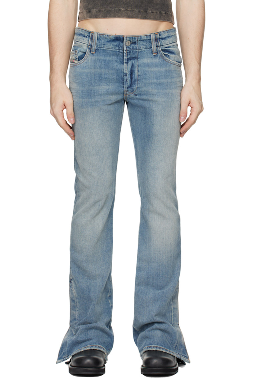 Non-stretch denim jeans. Fading and distressing throughout.

· Belt loops
· Five-pocket styling
· Button-fly
· Logo patch at coin pocket
· Vented cuffs 
· Logo embroidered at back pocket
· Logo-engraved silver-tone hardware
· Contrast stitching in tan

Supplier color: Light blue