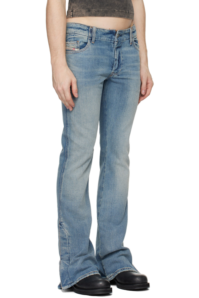 Non-stretch denim jeans. Fading and distressing throughout.

· Belt loops
· Five-pocket styling
· Button-fly
· Logo patch at coin pocket
· Vented cuffs 
· Logo embroidered at back pocket
· Logo-engraved silver-tone hardware
· Contrast stitching in tan

Supplier color: Light blue