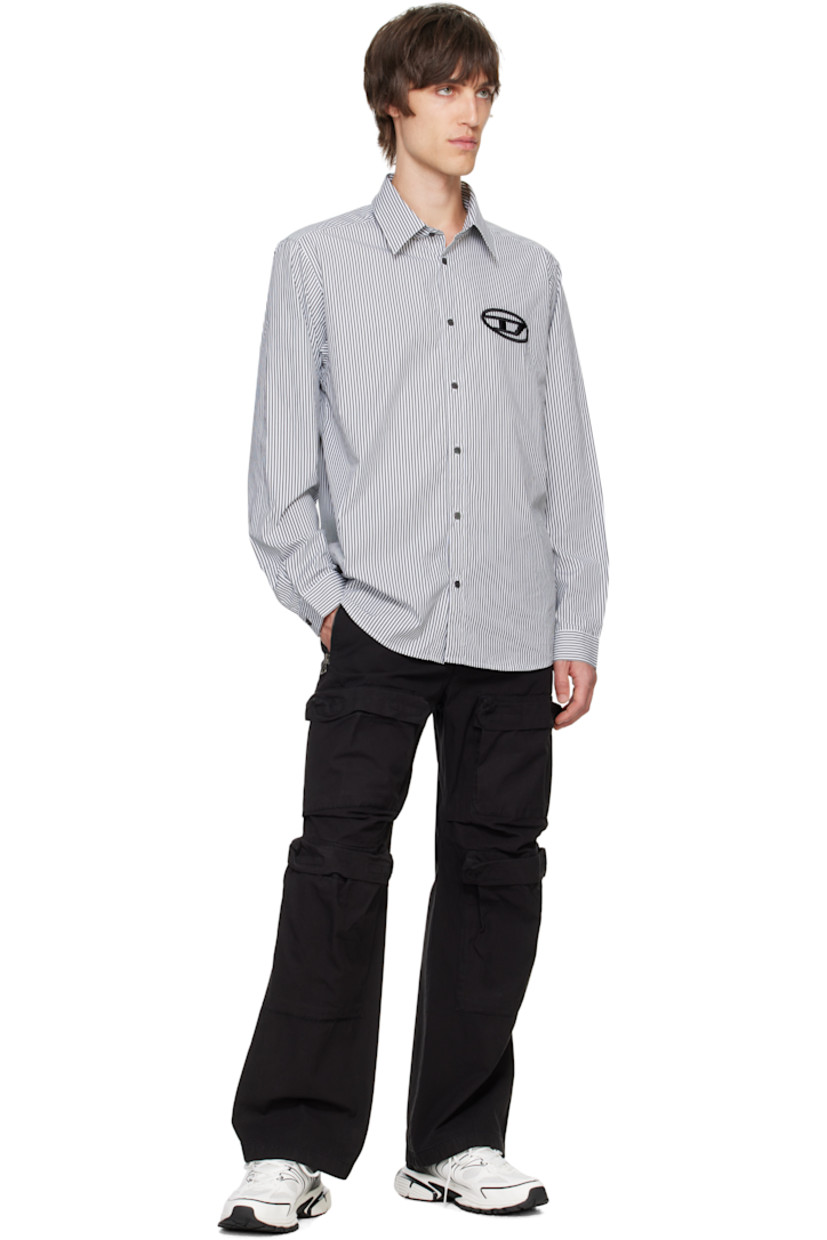 Cotton twill cargo pants. 

· Concealed drawstring at elasticized waistband
· Four-pocket styling
· Zip-fly
· Bellows pockets at legs
· Zip vent at cuffs 
· Logo embroidered at back
· Logo-engraved antiqued silver-tone hardware

Supplier color: Black