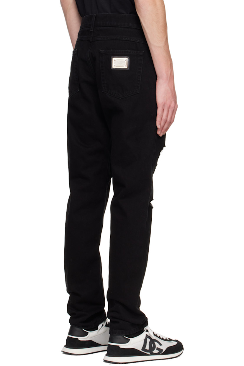 Non-stretch denim jeans. Distressing and subtle fading throughout.

· Belt loops
· Five-pocket styling
· Zip-fly
· Logo patch at coin pocket 
· Logo plaque at back pocket
· Logo-engraved silver-tone hardware

Supplier color: Black