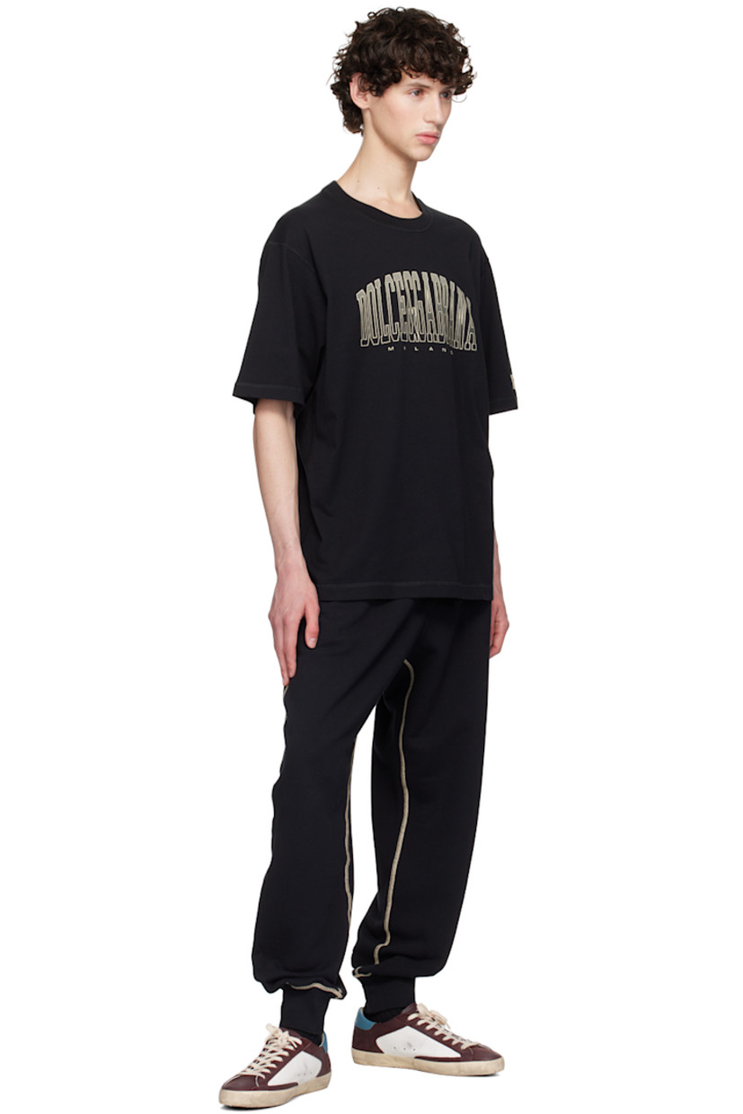 French terry sweatpants. 

· Drawstring at rib knit elasticized waistband 
· Three-pocket styling 
· Mock-fly 
· Logo graphic printed at front and back
· Elasticized cuffs 
· Contrast stitching in beige 

Supplier color: Nero