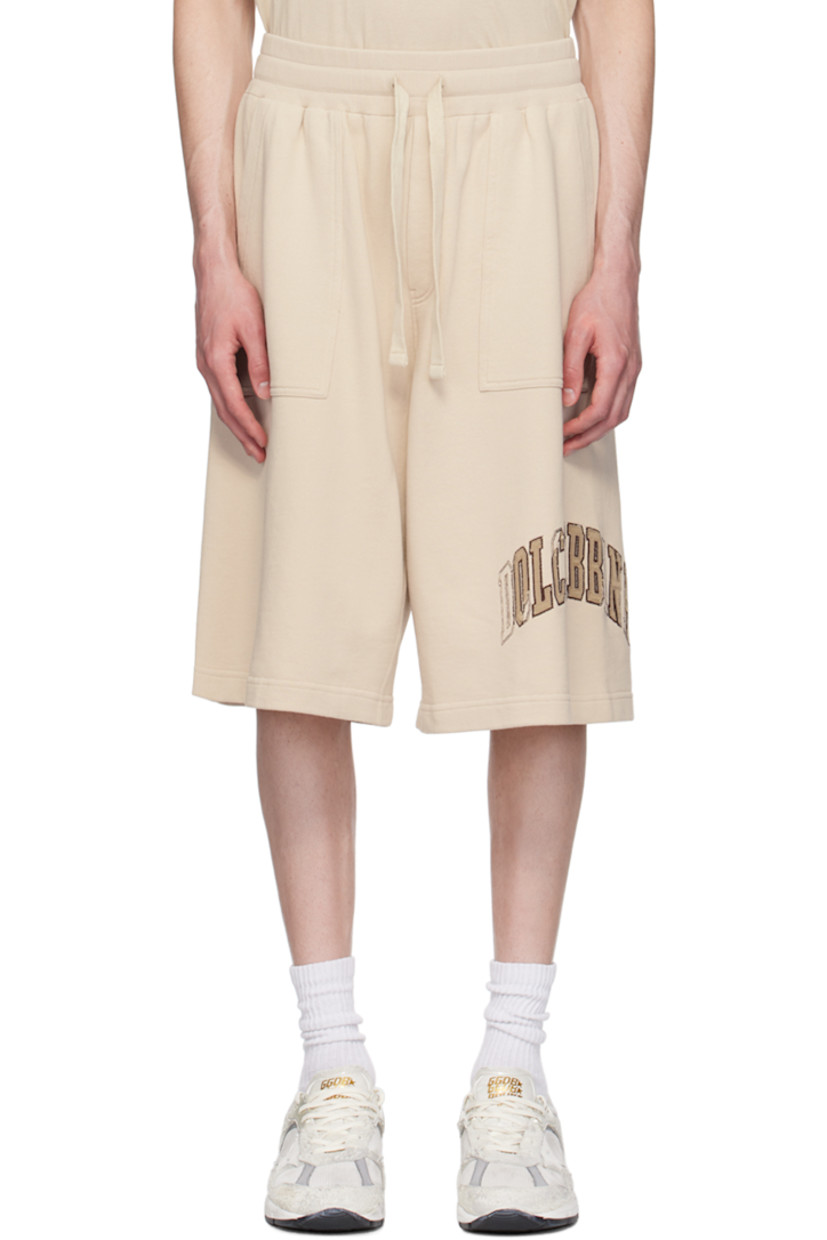 French terry shorts.

· Drawstring at rib knit elasticized waistband 
· Three-pocket styling
· Mock-fly 
· Logo embroidered at outseam 
· Logo patch at back pocket 

Supplier color: Pergamena medi