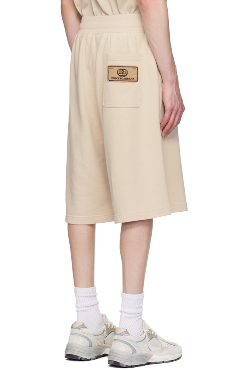 French terry shorts.

· Drawstring at rib knit elasticized waistband 
· Three-pocket styling
· Mock-fly 
· Logo embroidered at outseam 
· Logo patch at back pocket 

Supplier color: Pergamena medi
