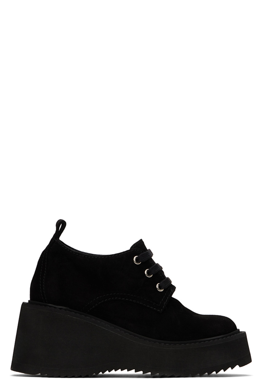 Suede heeled derbys in black.

· Lace-up closure
· Pull-tab at heel
· Logo printed at padded leather footbed
· Buffed leather lining
· Foam rubber platform midsole and wedge heel 
· Treaded rubber sole
· Platform: H1.5"
· Heel: H3"

Supplier color: Black
