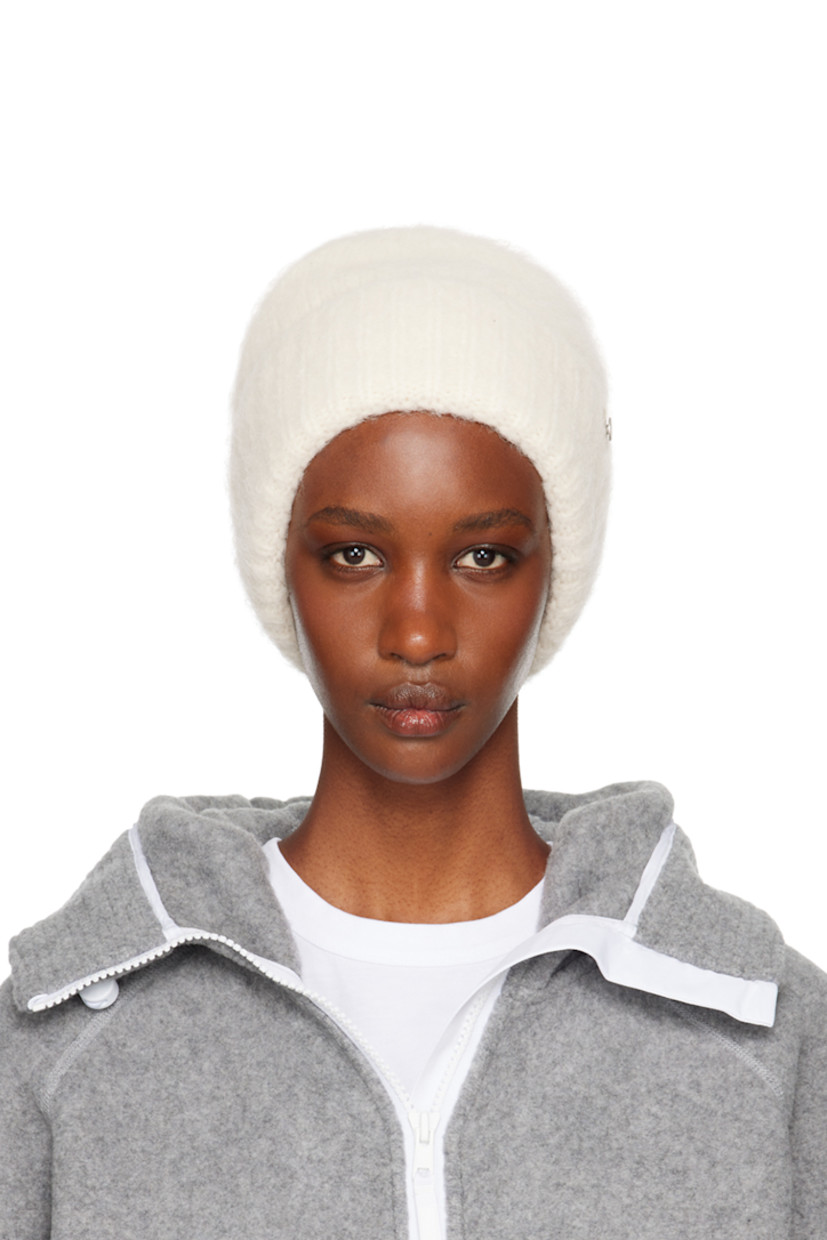 Brushed knit alpaca-blend beanie in off-white. Logo hardware at rib knit rolled brim.

Supplier color: Linen