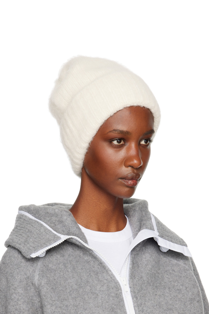 Brushed knit alpaca-blend beanie in off-white. Logo hardware at rib knit rolled brim.

Supplier color: Linen