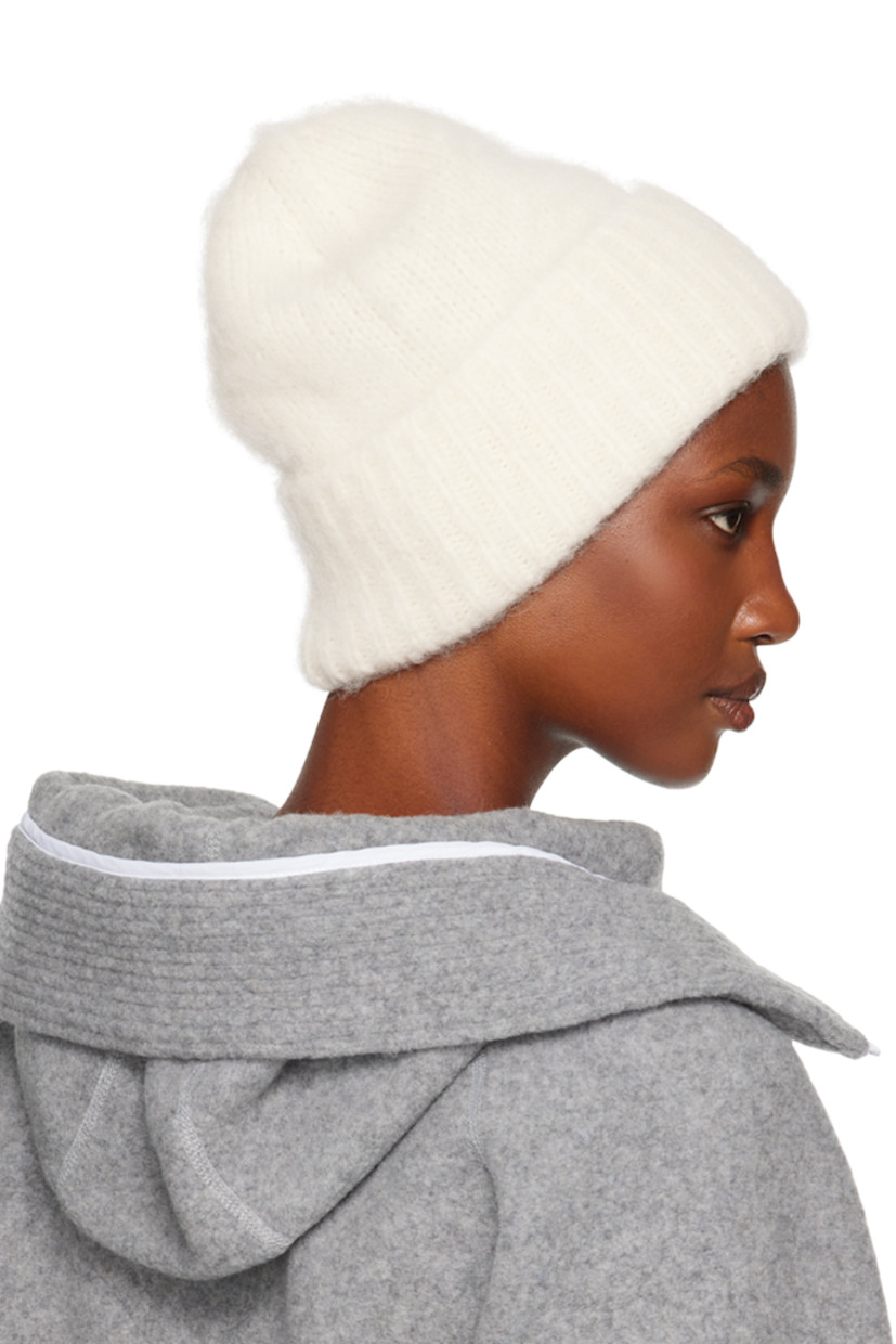 Brushed knit alpaca-blend beanie in off-white. Logo hardware at rib knit rolled brim.

Supplier color: Linen