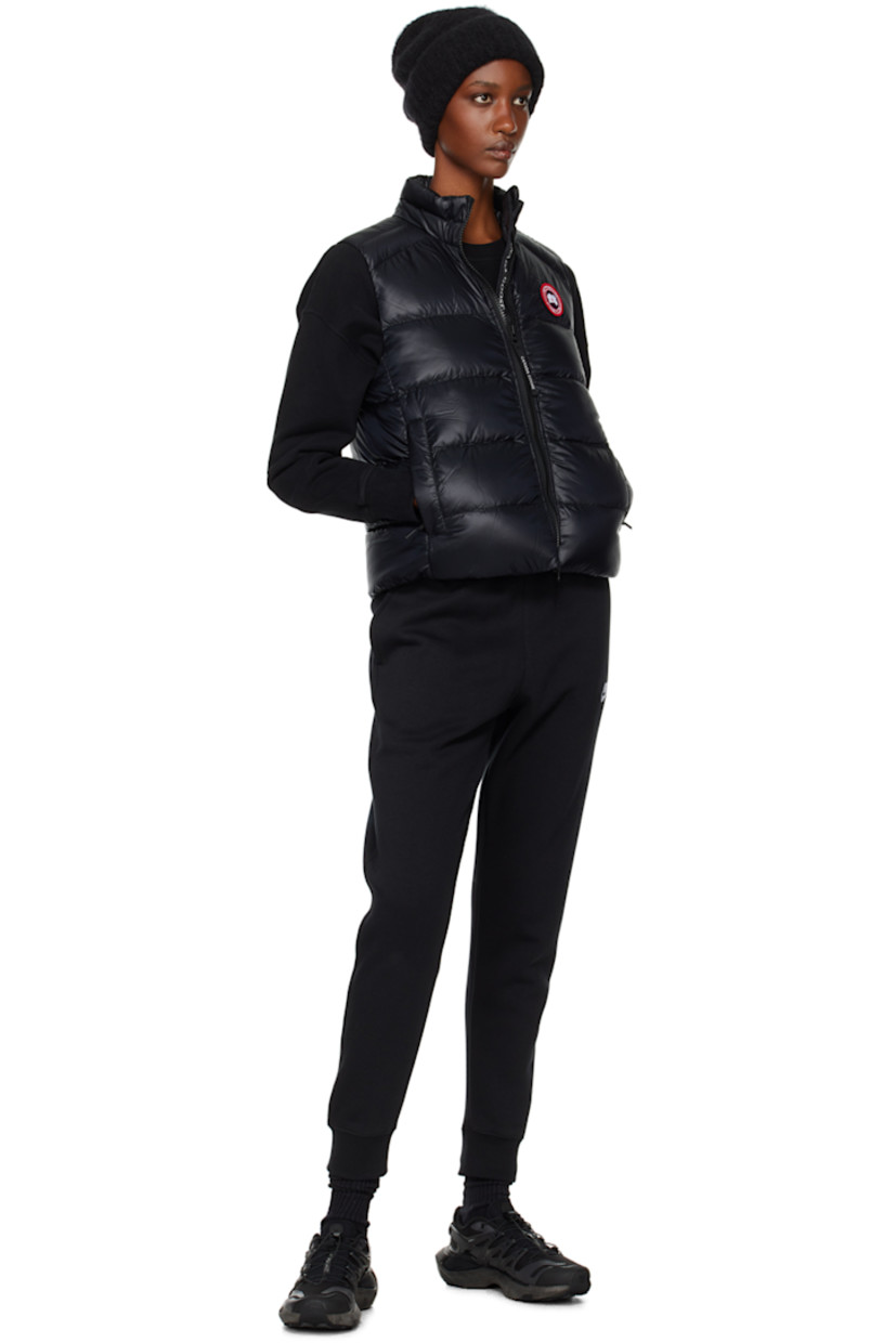 Packable down-filled and quilted recycled nylon ripstop vest. Lightweight, water-repellent, and wind-resistant.

· Stand collar
· Two-way zip closure
· Embroidered logo patch at chest
· Zip pockets
· Bungee-style drawstring at hem
· Patch pocket at interior
· Fully lined

Supplier color: Black

Fill: 90% duck down, 10% duck feather.
