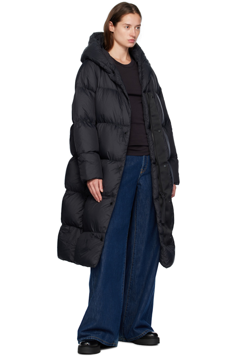Down-filled recycled nylon Lumina taffeta parka. Lightweight, water-repellent, and wind-resistant.

· Two-way zip closure with offset press-stud placket
· Zip seam pockets
· Logo patch at sleeve
· Inset rib knit cuffs
· Detachable logo-woven shoulder straps at interior
· Fully lined
· Logo-engraved black hardware

Supplier color: Black

Fill: 90% duck down, 10% duck feather.