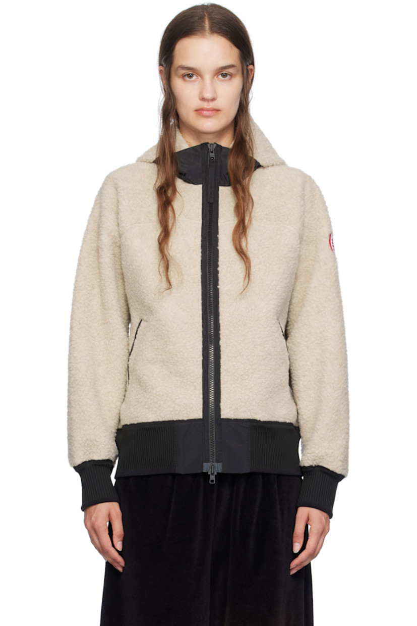 Recycled wool-blend fleece hoodie.

· CORDURA® nylon faille panel at hood
· Stand collar
· Two-way zip closure
· Welt pockets
· Rib knit hem and cuffs
· Embroidered logo patch at sleeve
· Reflective trim at back collar
· Full jersey lining

Supplier color: Light tan