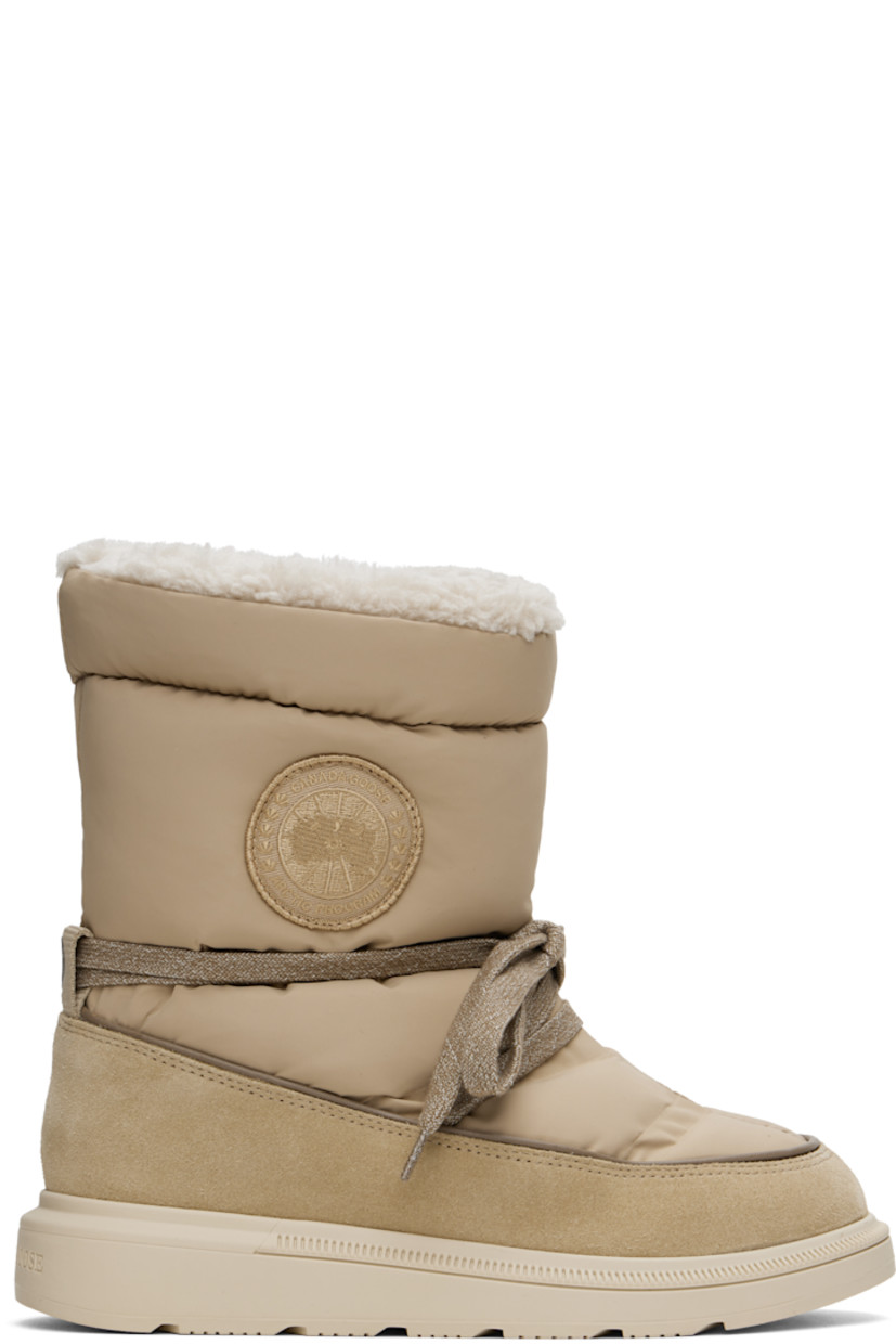 Ankle-high insulated quilted taffeta and suede boots in tan. Lightweight and water-resistant.

· Temperature rated to 0°C/-15°C
· Wraparound lace-up closure
· Bungee-style drawstring at collar
· Logo patch embroidered at outer side
· Pull-loop at heel counter
· Scalloped detailing at welt
· Shearling and fleece lining
· Logo embossed at midsole and heel
· Treaded rubber sole

Supplier color: Tan/Linen